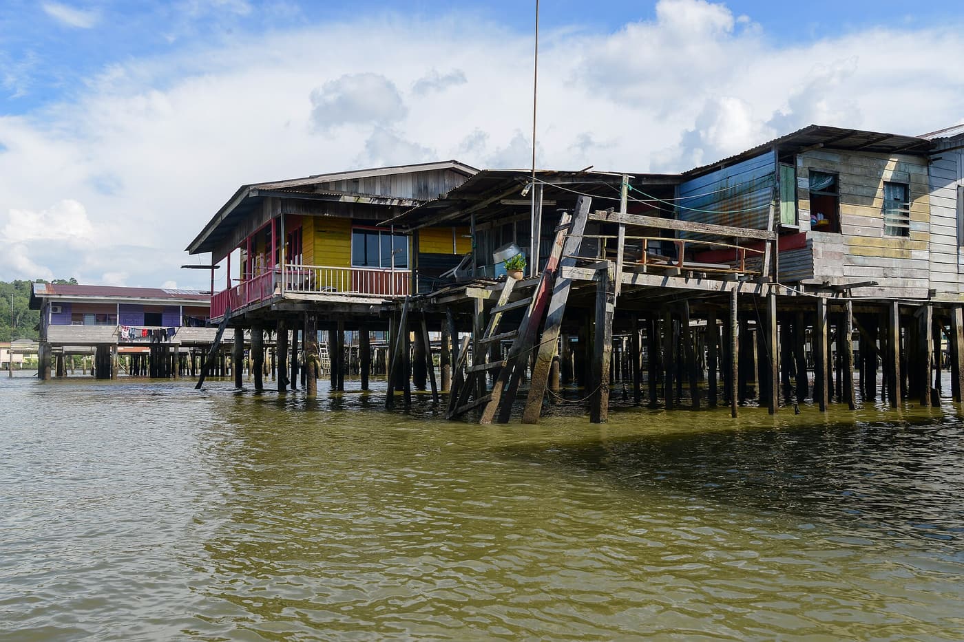 Wooden stilt houses of Kampong Ayer standing in the Brunei River